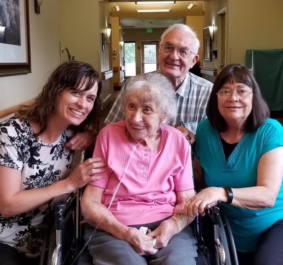 Julie with her grandmother, mother and father
